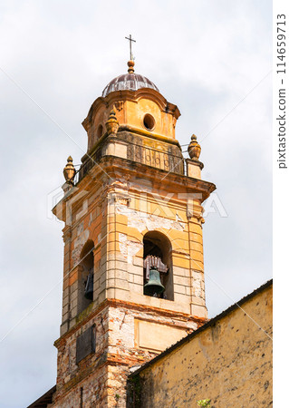 aged bell tower with peeling paint 114659713