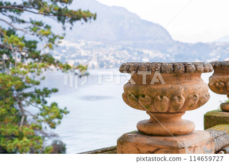 stone baluster overlooking scenic lake view.. stone baluster overlooking scenic lake view.. 114659727