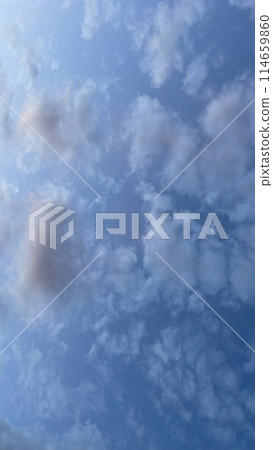 A Dramatic Sky at Dawn.The Mesmerizing Dance of Early Morning Clouds.Early Morning Drama.The Enchanting Dance of Dawn Clouds. 114659860