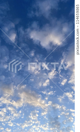 A Dramatic Sky at Dawn.The Mesmerizing Dance of Early Morning Clouds.Early Morning Drama.The Enchanting Dance of Dawn Clouds. 114659865