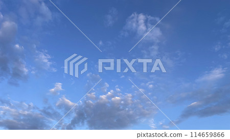 A Dramatic Sky at Dawn.The Mesmerizing Dance of Early Morning Clouds.Early Morning Drama.The Enchanting Dance of Dawn Clouds. 114659866