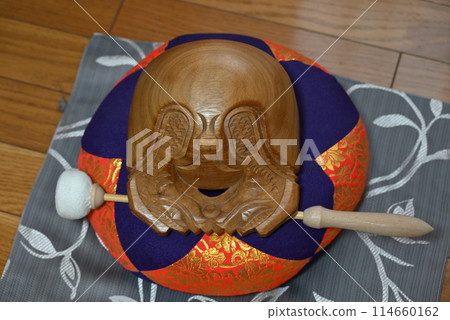 The blessed wooden fish of the Buddhist altar The blessed wooden fish of the Buddhist altar 114660162
