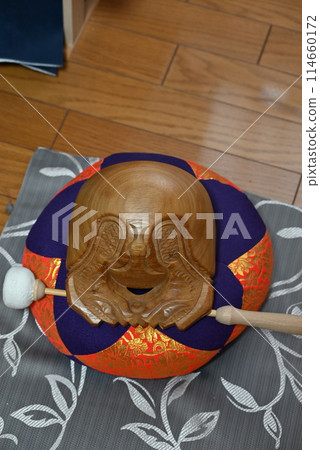 The blessed wooden fish of the Buddhist altar The blessed wooden fish of the Buddhist altar 114660172