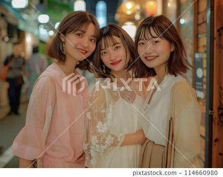 Three friendly girls going out 114660980