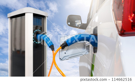 Close-up of electric charging station on a background of blue sky. 114662516