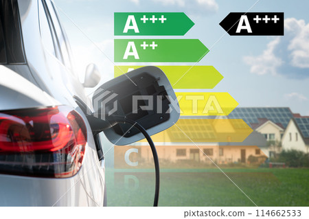 Close up of electric car inlet with energy label. 114662533