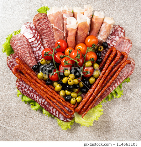 Beautiful serving of sausage sliced meat delicacies 114663103