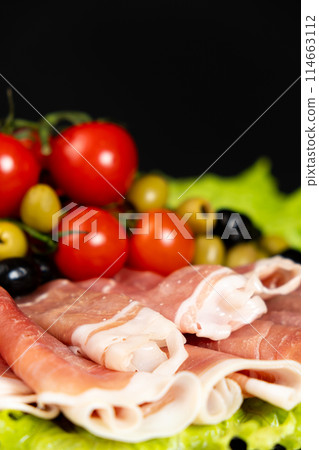 Traditional serrano ham, dry-cured pork jamon 114663112