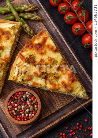 Delicious quiche with broccoli, cheese, chicken, spices and herbs 114663731