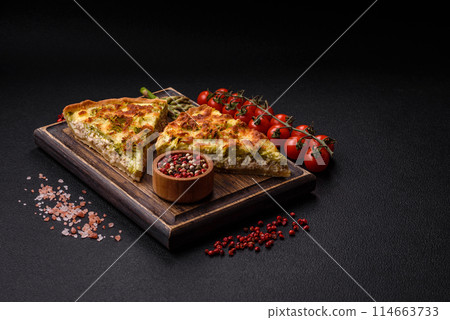 Delicious quiche with broccoli, cheese, chicken, spices and herbs 114663733