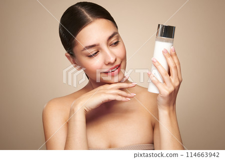 Young woman doing scrapping massage facial skin Young woman doing scrapping massage facial skin 114663942