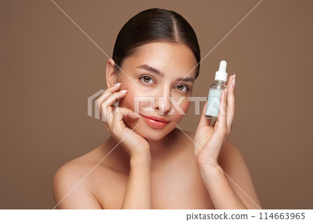 Young woman doing scrapping massage facial skin 114663965