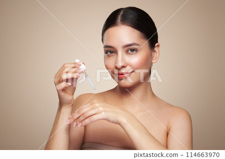 Young woman doing scrapping massage facial skin 114663970