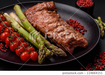 Raw pork ribs marinated with salt, spices and herbs 114664151