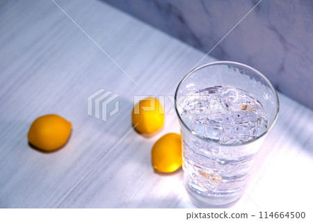 Glass of ice and water with lemon 114664500