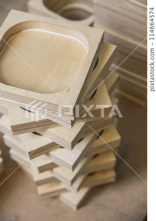 wooden bases Audio Speakers stacked like a tower at the factory wooden bases Audio Speakers stacked like a tower at the factory 114664574