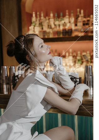 A young couple in wedding looks posing in a stylish loft bar. 114665032