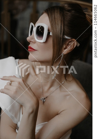 A young couple in wedding looks posing in a stylish loft bar. 114665062