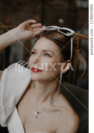 A young couple in wedding looks posing in a stylish loft bar. 114665066