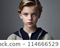 Stunning portrait of a young boy with piercing blue eyes 114666529