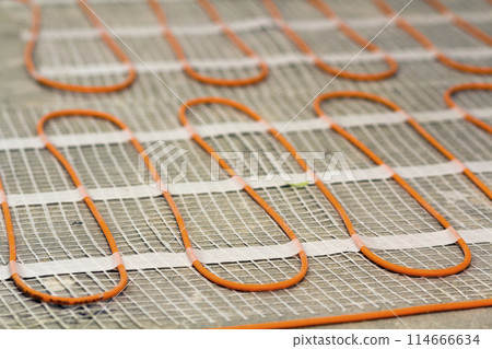 Heating cable for warm floor close-up detail. Renovation works. 114666634