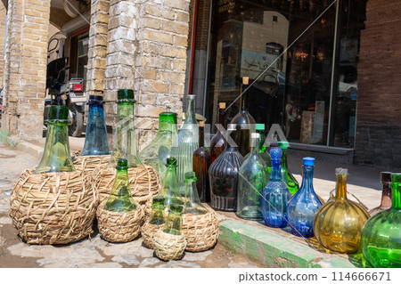 Colorful glass bottles displayed in Kashan, Iran. Colorful glass bottles displayed in Kashan, Iran. 114666671