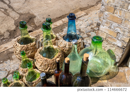 Colorful glass bottles displayed in Kashan, Iran. Colorful glass bottles displayed in Kashan, Iran. 114666672
