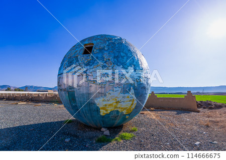 The weathered globe monument in an abandoned station in Tehran. The weathered globe monument in an abandoned station in Tehran. 114666675