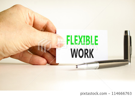 Flexible work symbol. Concept words Flexible work on beautiful white paper. Beautiful white background. Businessman hand. Business Flexible work concept. Copy space. 114666763