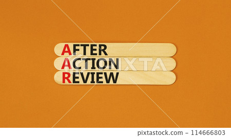 AAR After action review symbol. Concept words AAR After action review on beautiful wooden stick. Beautiful orange background. Business AAR after action review concept. Copy space. 114666803