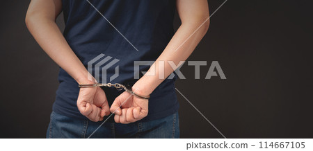 Arrested man with handcuffed hands 114667105
