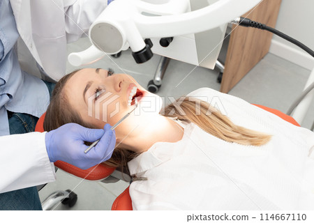 Dental treatment. Woman on dental examination 114667110