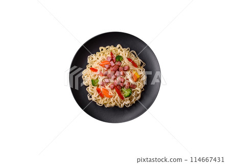 Delicious Asian dish rice noodles or udon with vegetables, spices and herbs 114667431