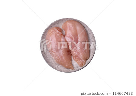 Raw chicken fillet with salt, spices and herbs 114667458