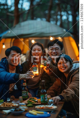Group of Asian friends eating and camping in the forest. Group of Asian friends eating and camping in the forest. 114667809