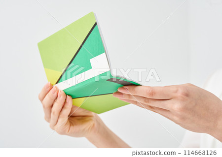 A woman's hand looking at her bank passbook 114668126