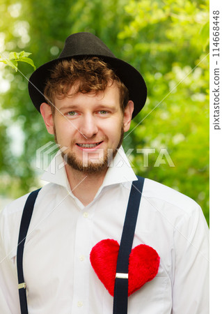 young man retro style with red heart on chest young man retro style with red heart on chest 114668448