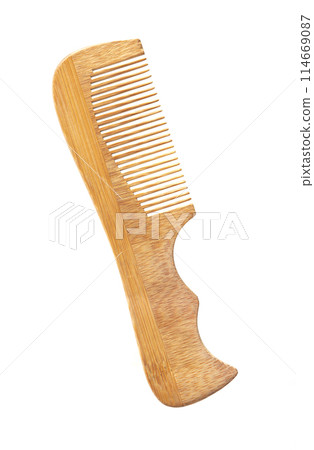 A wooden comb on white background 114669087