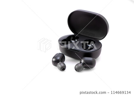 Wireless headphones isolated on a white background. Headset close up in the charging case close-up. 114669134
