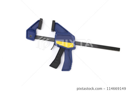 Modern bar clamp with quick release. Carpenters and joiners one handed spring lever quick release clamp for temporary holding of wood and objects in the shop and on site 114669149