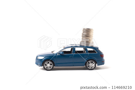Blue toy iron car with coins on a white background. concept of earnings, income and high cost 114669210