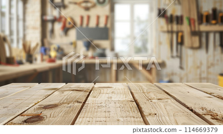 Empty light wooden table. Carpentry workshop. Blurred background Empty light wooden table. Carpentry workshop. Blurred background 114669379