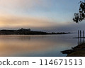 From the riverbank in the morning mist 114671513