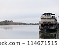 From the riverbank in the morning mist 114671515