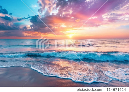 Vibrant pastel sunset reflecting on waves at tropical beach 114671624