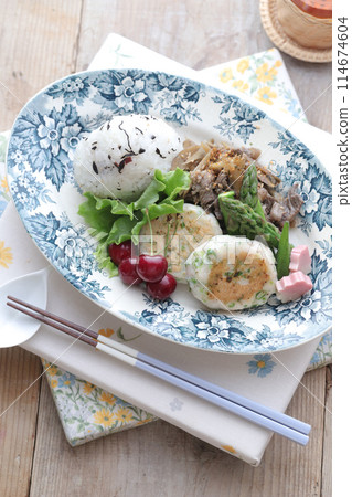 Lotus root burger and rice balls on a plate Lotus root burger and rice balls on a plate 114674604