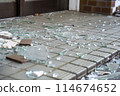 Broken window glass scattered on the ground 114674652