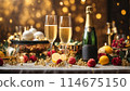 A table with champaigne bottle and glasses is covered with a variety of fruits, oranges and lemons 114675150