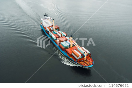 Cargo ship in the ocean carrying containers Cargo ship in the ocean carrying containers 114676621