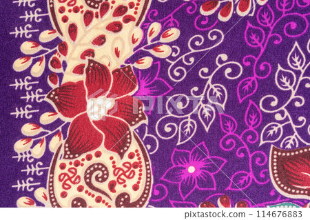 Detailed flower pattern of Indonesian batik cloth textile. 114676883